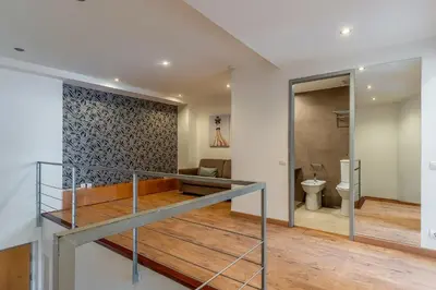 a staircase leading to a bathroom with a toilet at AB Sagrada Familia - Gaudí in Barcelona