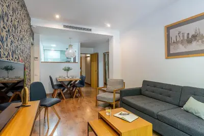 a living room with a couch and a table at AB Sagrada Familia - Gaudí in Barcelona