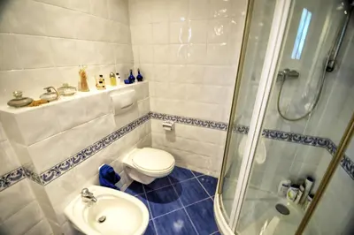 a bathroom with a shower and a toilet and a sink at Can Ferran by Hello Homes Sitges in Sitges