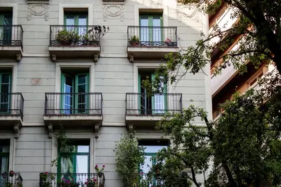 a building with balconies and plants on it at Ramblas Apartments in Barcelona