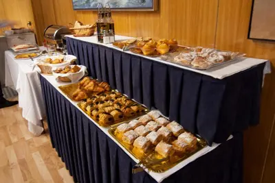 a buffet line with different types of bread and pastries at Hotel Domo in Vilafranca del Penedès