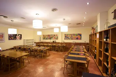 a restaurant with tables and chairs in a room at Hotel Domo in Vilafranca del Penedès