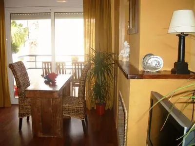 a dining room with a table and chairs and a dining room at Sitges Beach Loft in Sitges