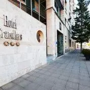 a building with a sign on the side of it at Hotel Granollers in Granollers