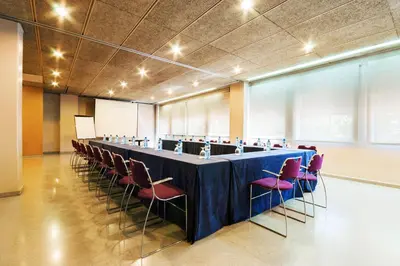 a large conference room with a long table and chairs at Hotel Granollers in Granollers