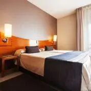 a hotel room with a bed and a window at Hotel Granollers in Granollers