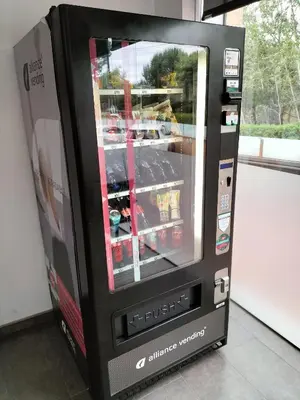 a video game vending machine with a tv in it at Hotel 170 in Castelldefels