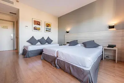 a hotel room with two beds in a room at Hotel Air Penedès in Vilafranca del Penedès
