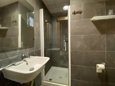 a bathroom with a sink and a shower at Hostal Bonavista in Calella
