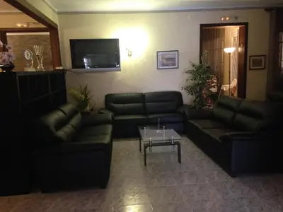 a living room with couches and a coffee table at Hostal Bonavista in Calella