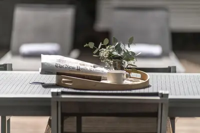 a plate with a coffee cup and a plant on a table at Casp 74 Apartments in Barcelona