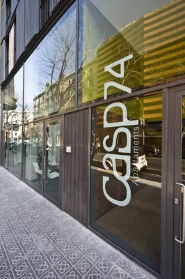 a store front with a sale sign in the window at Casp 74 Apartments in Barcelona