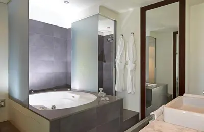 a bathroom with a tub and a sink at Sixtytwo Hotel in Barcelona