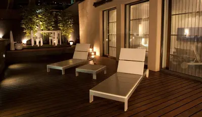 a patio with two chairs and a table on a balcony at Sixtytwo Hotel in Barcelona