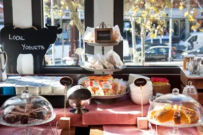 a display of food on a table in front of a window at Sixtytwo Hotel in Barcelona