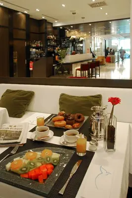 a table with a tray of food on a table at Grupotel Gran Via 678 in Barcelona