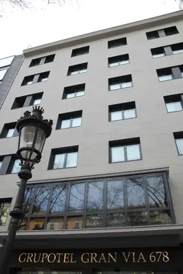 a street light in front of a building at Grupotel Gran Via 678 in Barcelona