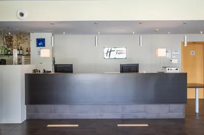 a bar in a restaurant with a counter top at Holiday Inn Express Sant Cugat by IHG in Sant Cugat del Vallès