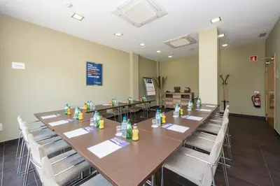 a conference room with a long table and chairs at Holiday Inn Express Sant Cugat by IHG in Sant Cugat del Vallès