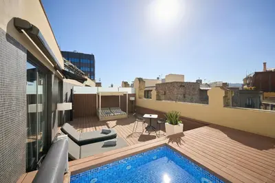 a balcony with a swimming pool on top of a building at Catalonia Catedral in Barcelona