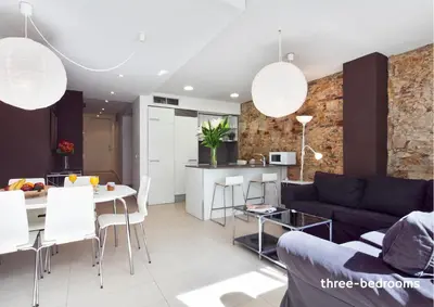 a living room with a couch and a table at Inside Barcelona Apartments Sants in Barcelona