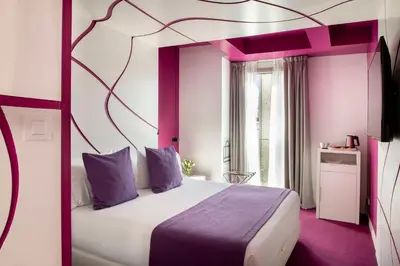 a bedroom with a large bed with purple accents at Allegro Barcelona in Barcelona