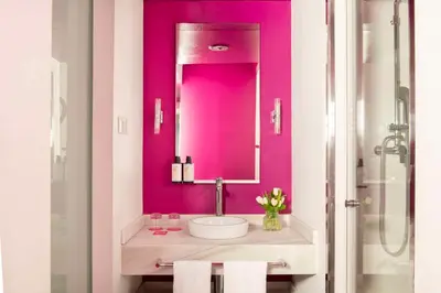 a pink bathroom with a sink and a mirror at Allegro Barcelona in Barcelona