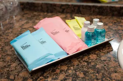 a tray with bottles of liquids on a counter at Bed and Breakfast El Pekinaire in Calella