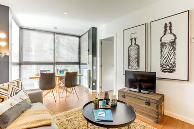 a living room with a couch and a tv at Sweett - Raul in Barcelona