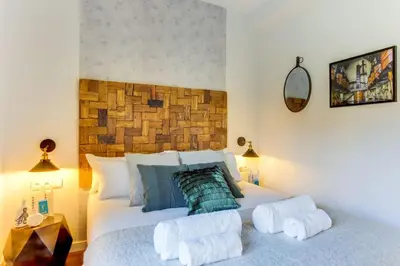 a bedroom with a bed with towels on it at Sweett - Raul in Barcelona
