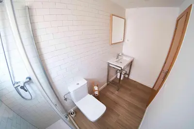 a bathroom with a toilet and a sink at Vila De Premiá in Premiá de Mar