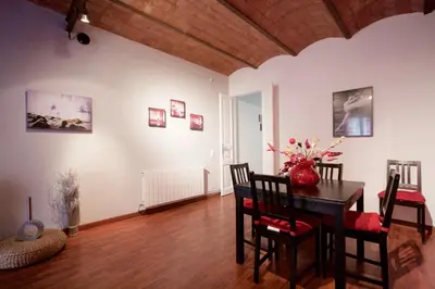 a dining room with a table and chairs at Charm Rambla Catalunya in Barcelona