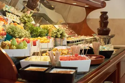 a buffet with many different types of fruits and vegetables at Checkin Garbí in Calella