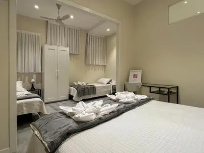a bedroom with two beds with white towels on them at Barcelona City Ramblas in Barcelona
