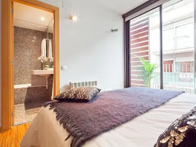 a bedroom with a large bed and a large mirror at Apartment Barcelona Rentals - Penthouse with Terrace in Barcelona