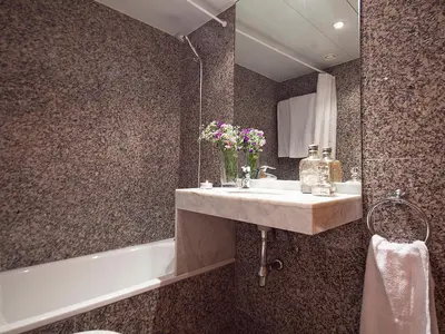 a bathroom with a sink and a bath tub at Apartment Barcelona Rentals - Penthouse with Terrace in Barcelona