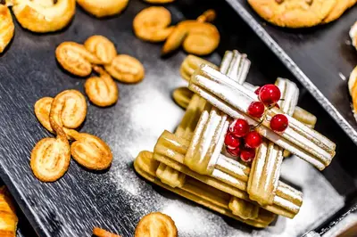 a tray of crackers and other snacks on a table at Dorma Ramblas Boquería in Barcelona