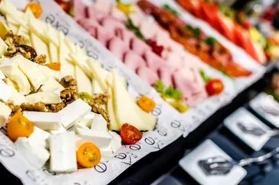 a display of different types of food on a table at Dorma Ramblas Boquería in Barcelona