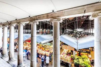 a view of a market with people walking through it at Dorma Ramblas Boquería in Barcelona