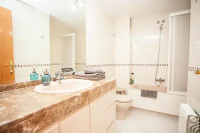 a bathroom with a sink and a toilet and a tub at Sitges Center & Beach Espalter in Sitges