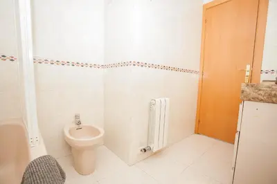 a bathroom with a toilet and a sink at Sitges Center & Beach Espalter in Sitges