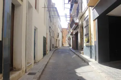 an empty alley way between buildings in a city at L'Hostalet d'Arenys de Mar in Arenys de Mar