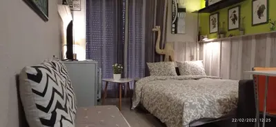 a small bedroom with a bed and a table at Apartment Oliver in Calella