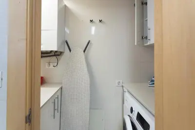 a kitchen with a towel hanging on the wall at Apartment Barcelona Rentals - Swimming Pool with Terrace in Barcelona