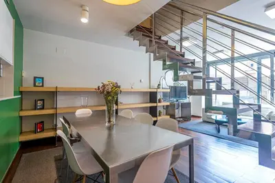 a dining room with a table and chairs and a staircase at Apartment Barcelona Rentals - Swimming Pool with Terrace in Barcelona