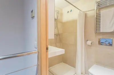 a bathroom with a shower and a toilet at Apartment Barcelona Rentals - Swimming Pool with Terrace in Barcelona