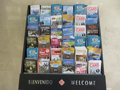 a black box filled with different types of books at Hostal Operaramblas in Barcelona