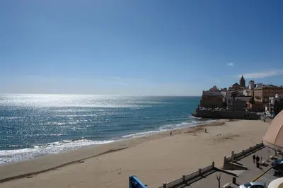 a view of a beach and the ocean at Sitges Beach Panorama in Sitges