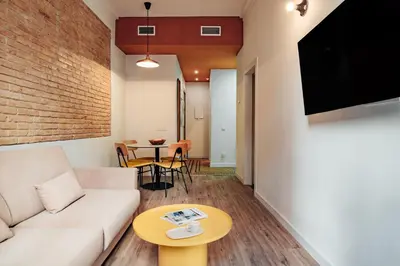a living room with a couch and a table at Design Apartments by Olala Homes in Hospitalet de Llobregat