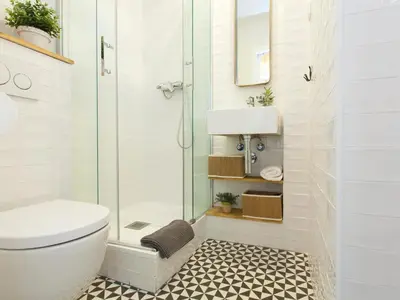 a bathroom with a shower and a toilet and a sink at Cozy Gracia 2 bedrooms in Barcelona